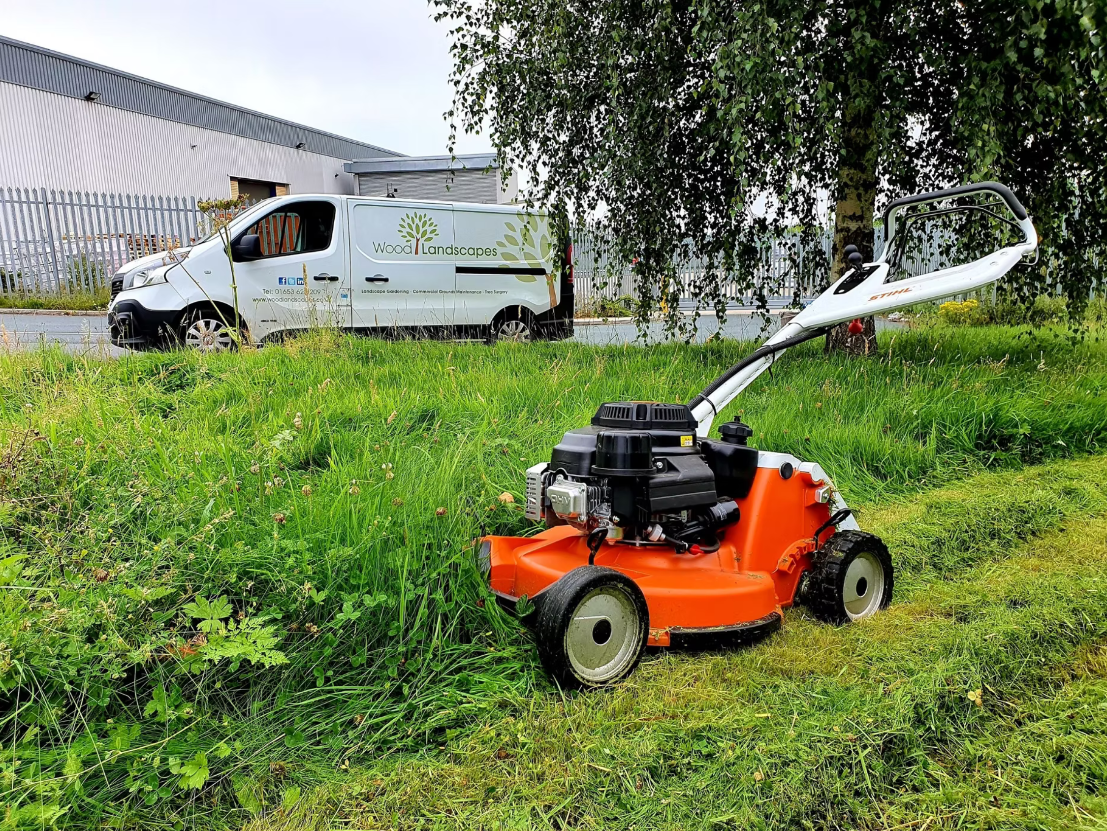 Wood Landscapes mower and branded vehicle on site